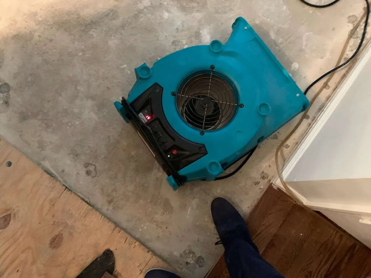 Air mover drying subfloor during Leak Detection & Repair in Wake Village